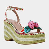 Colorful raffi green striped wedge sandal with with fruit strap and strawberry embellishment from side