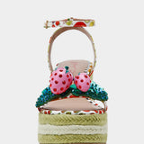 Colorful raffi green striped wedge sandal with with fruit strap and strawberry embellishment from front