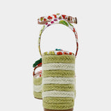 Colorful raffi green striped wedge sandal with with fruit strap and strawberry embellishment from back