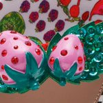 close up of strawberry embellishment on betsey johnson sandal 