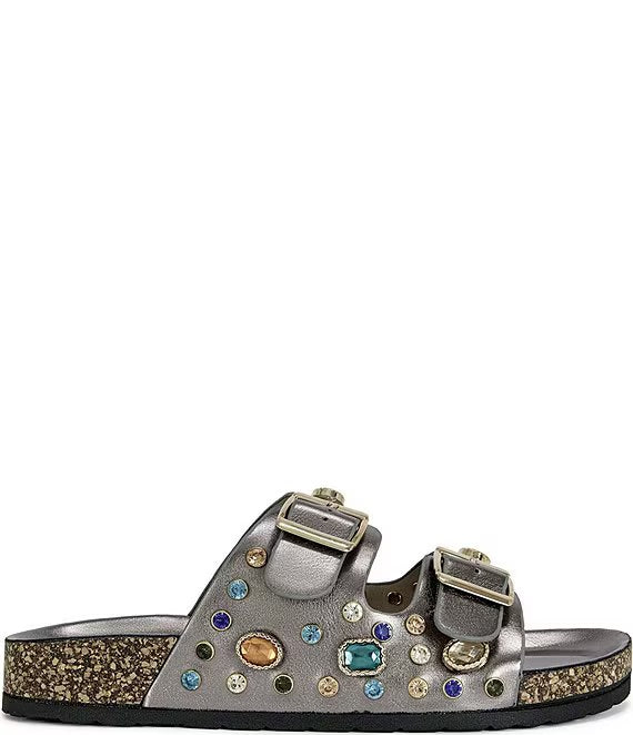 Silver sandal with gemstone embellishments on a white background