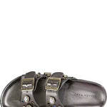Silver sandals with embellishments on a white background