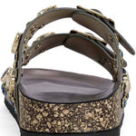 Close-up of a sandal with embellishments on a white background