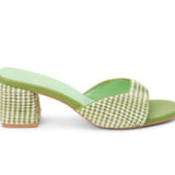 Green woven sandal with a block heel close-up