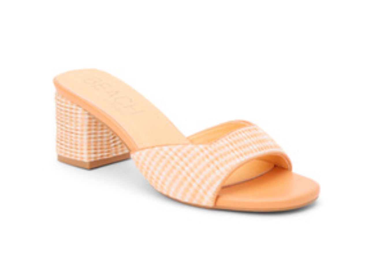 Orange woven sandal with a block heel side