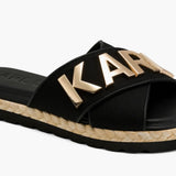 Black slide sandal with gold logo and woven strap side