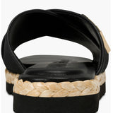 Black slide sandal with gold logo and woven strap heel