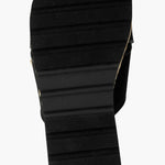 Black slide sandal with gold logo and woven strap sole