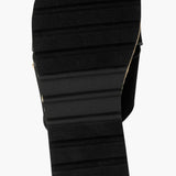 Black slide sandal with gold logo and woven strap sole