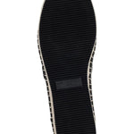 Black flat moccasin-styled shoe with decorative elements sole