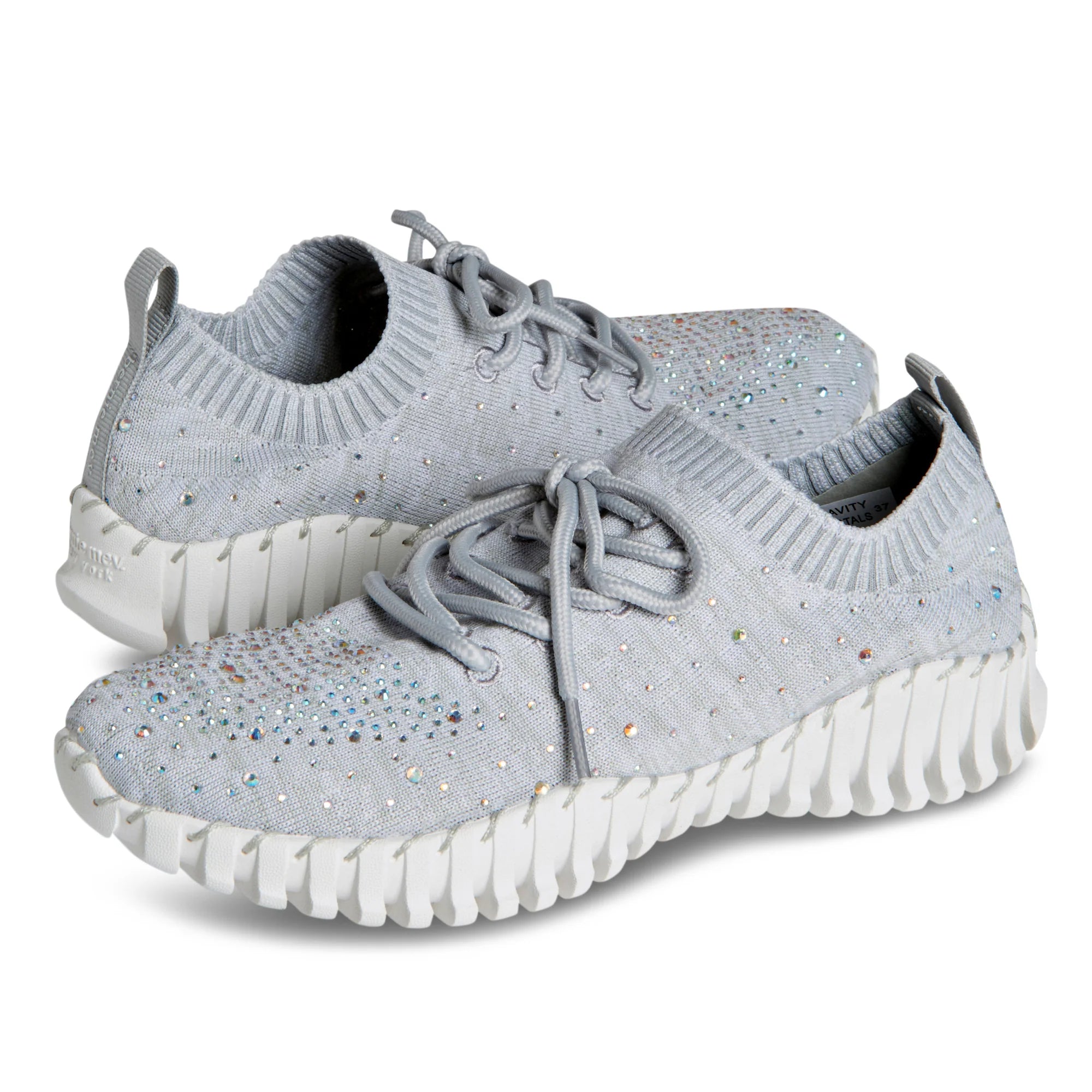 Gray bejeweled sneaker with white sole pair