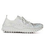 White sneaker with rhinestone embellishments close-up