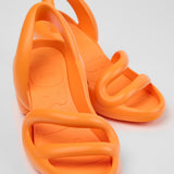 Orange high-heeled shoe pair