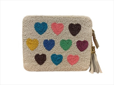Beige pouch with colorful heart patterns and a tassel on a white background