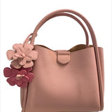 Pink handbag with floral details 