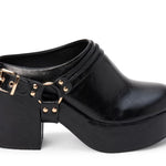 A black leather platform clog shoe with a chunky block heel, a decorative strap across the instep featuring gold-tone studs and a buckle, and a rounded toe, shown against a plain white background.