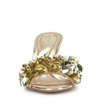Gold high-heeled shoe with gold sequin embellishments toe box