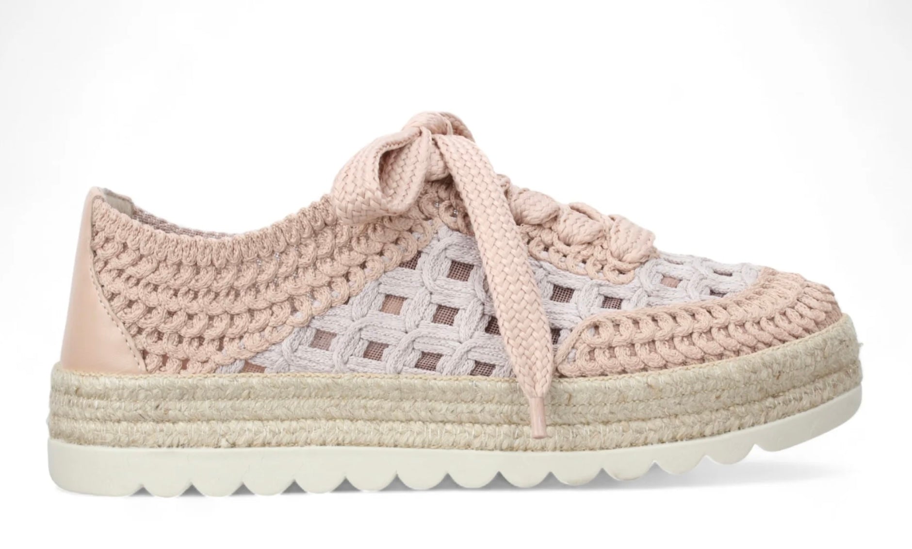 Pink woven sneaker with textured sole close-up
