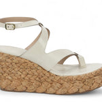 White sandal with a cork wedge sole close-up