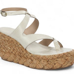 White sandal with a cork wedge sole side view