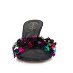 Black high-heeled shoe with colorful floral sequin embellishments toe box