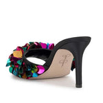 Black high-heeled shoe with colorful floral sequin embellishments heel view