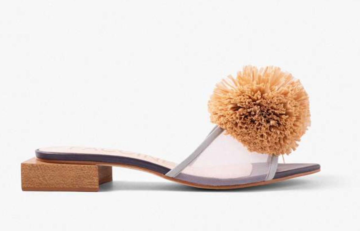 Sandal with a brown pom-pom and square heel close-up
