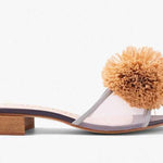 Sandal with a brown pom-pom and square heel close-up