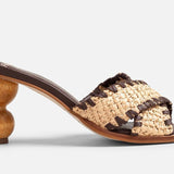 Brown and tan woven sandal with wooden bubble heel close up