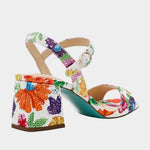 Colorful floral-patterned heel with buckle closure heel view