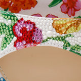 Colorful floral-patterned heel with buckle closure close-up
