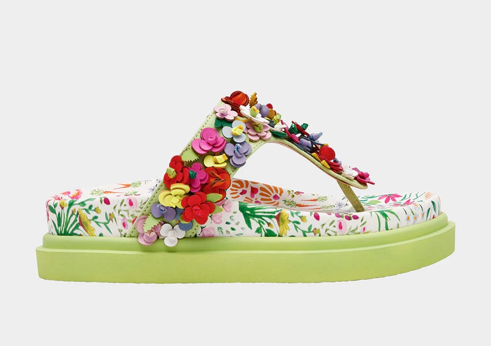 Colorful floral sandal with a green sole close-up