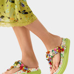 Colorful floral sandal with a green sole model