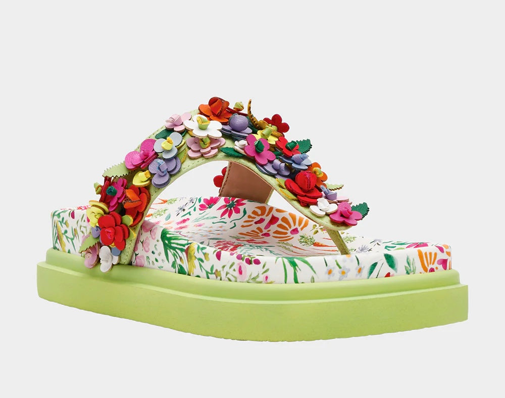 Colorful floral sandal with a green sole front