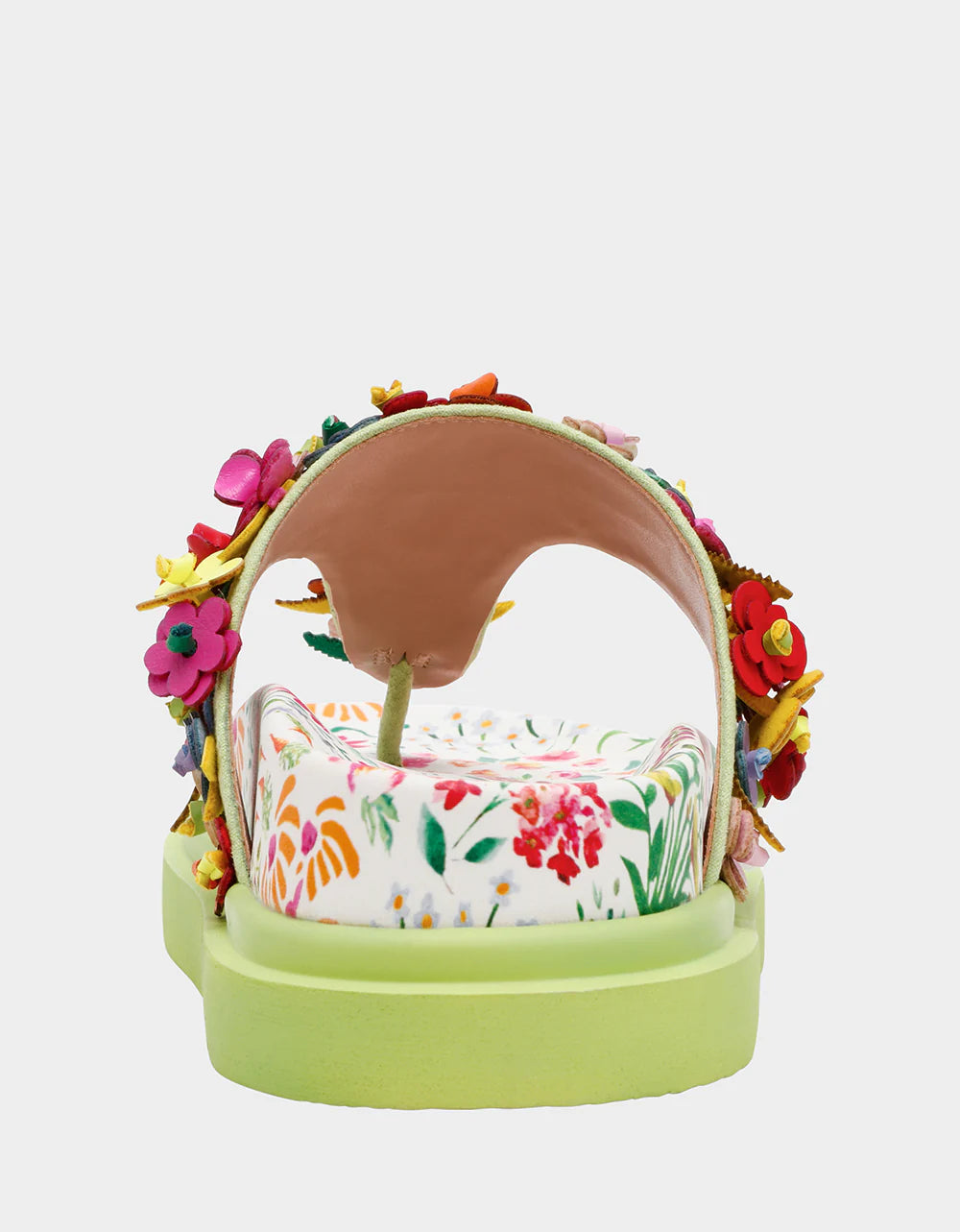 Colorful floral sandal with a green sole heel view