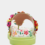 Colorful floral sandal with a green sole heel view