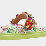 Colorful floral sandal with a green sole side view