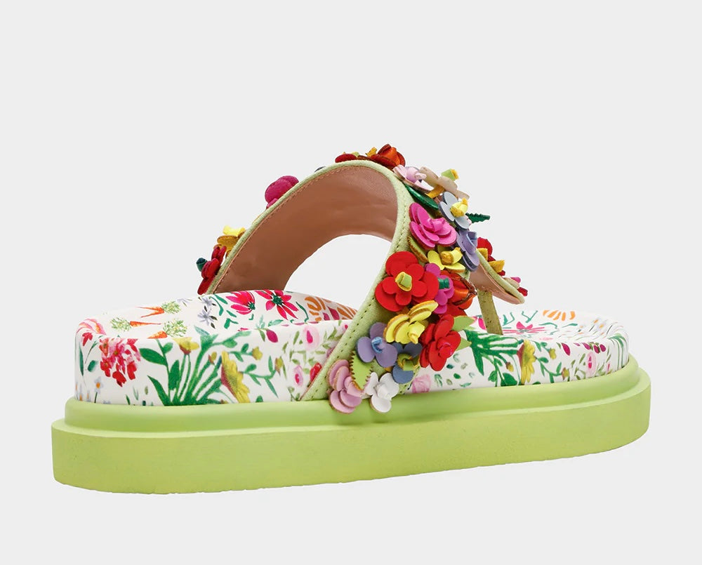 Colorful floral sandal with a green sole side view