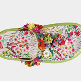 Colorful floral sandal with a green sole top view