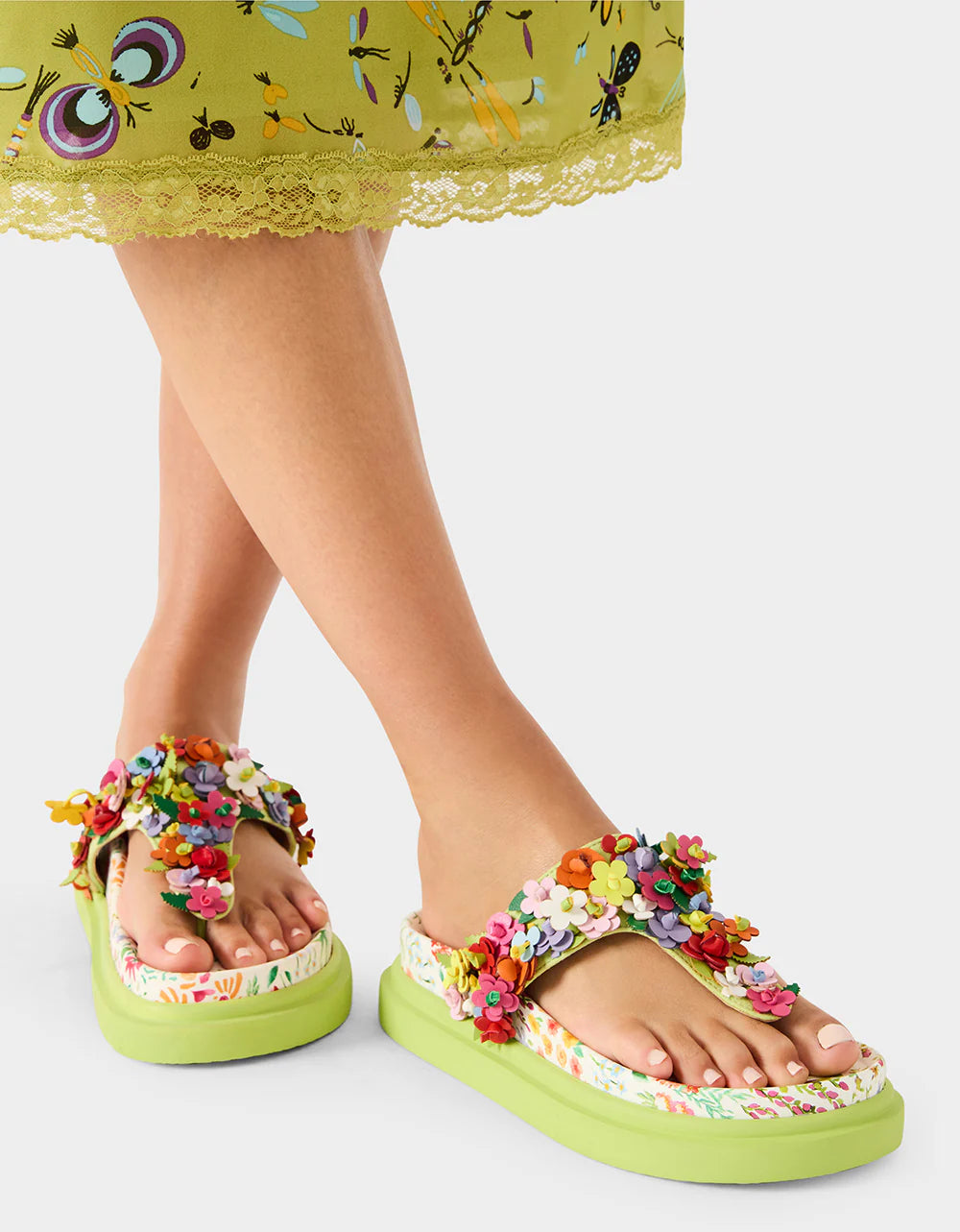 Colorful floral sandal with a green sole alternate model view