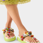 Colorful floral sandal with a green sole alternate model view