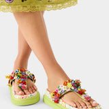Colorful floral sandal with a green sole alternate model view