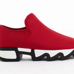 Red slip-on shoe with black & white sole close-up