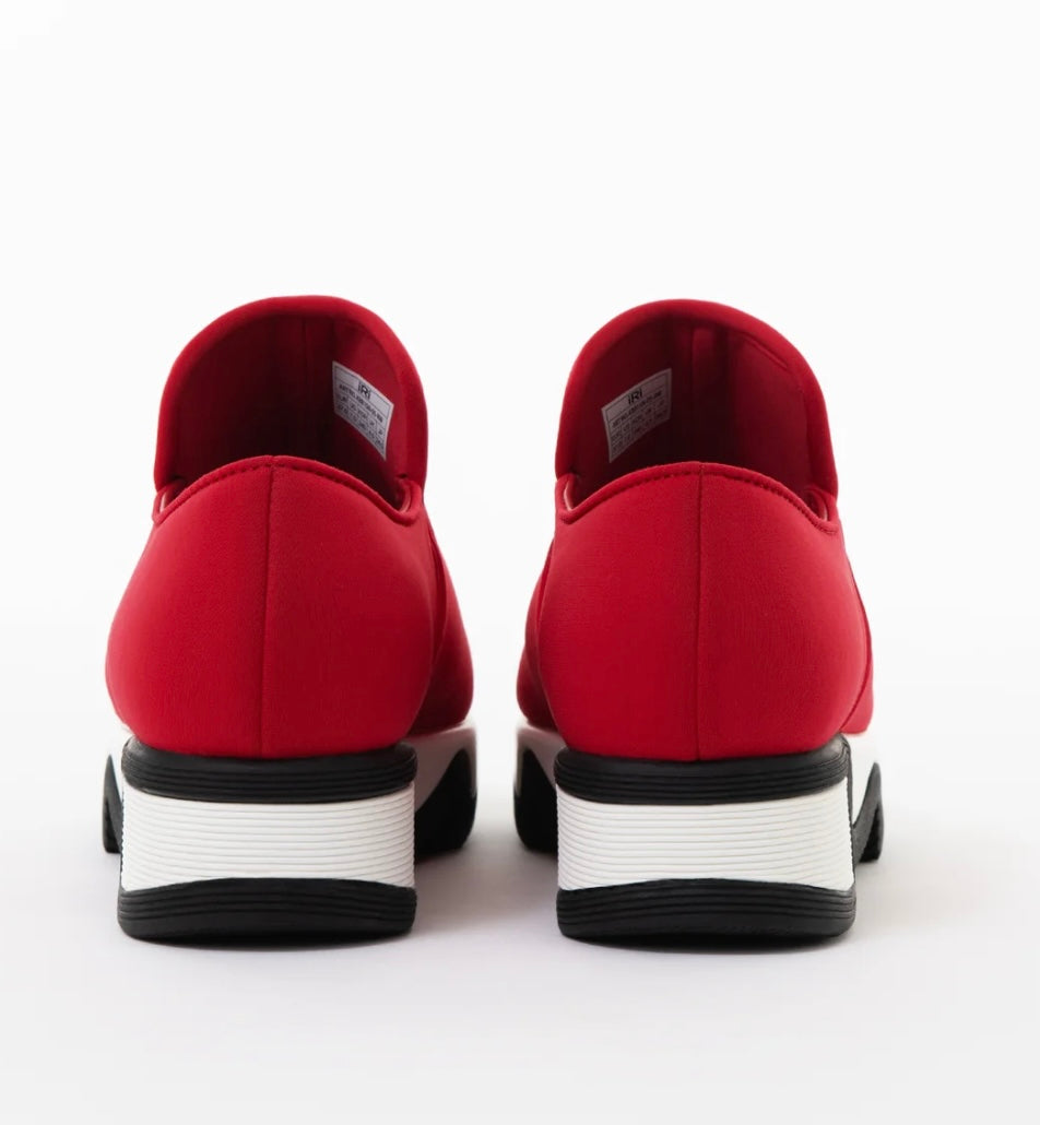 Red slip-on shoe with black & white sole heel view