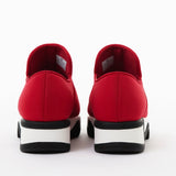 Red slip-on shoe with black & white sole heel view