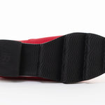 Red slip-on shoe with black & white sole sole view