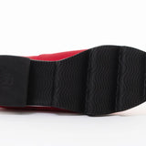 Red slip-on shoe with black & white sole sole view