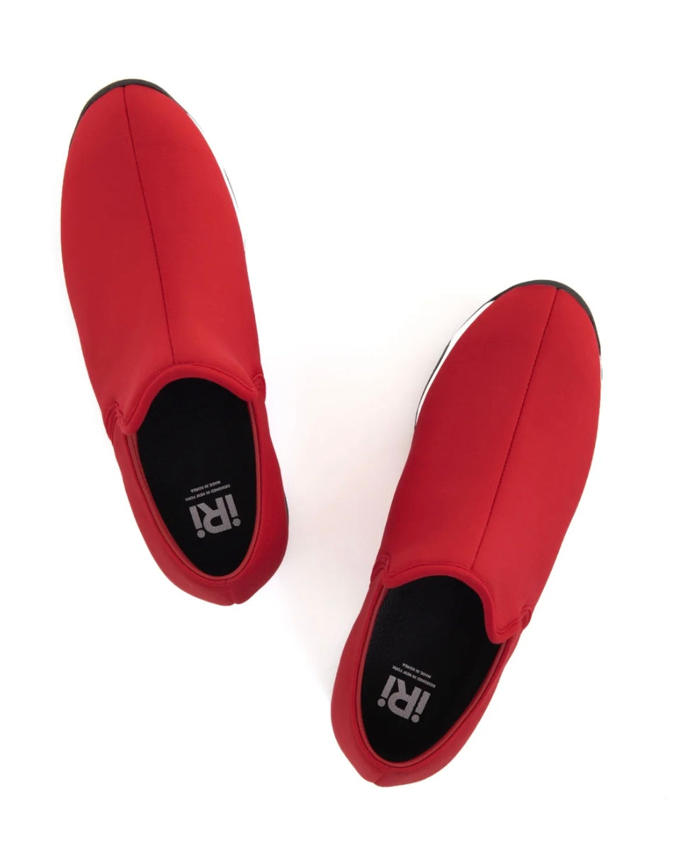 Red slip-on shoe with black & white sole top view