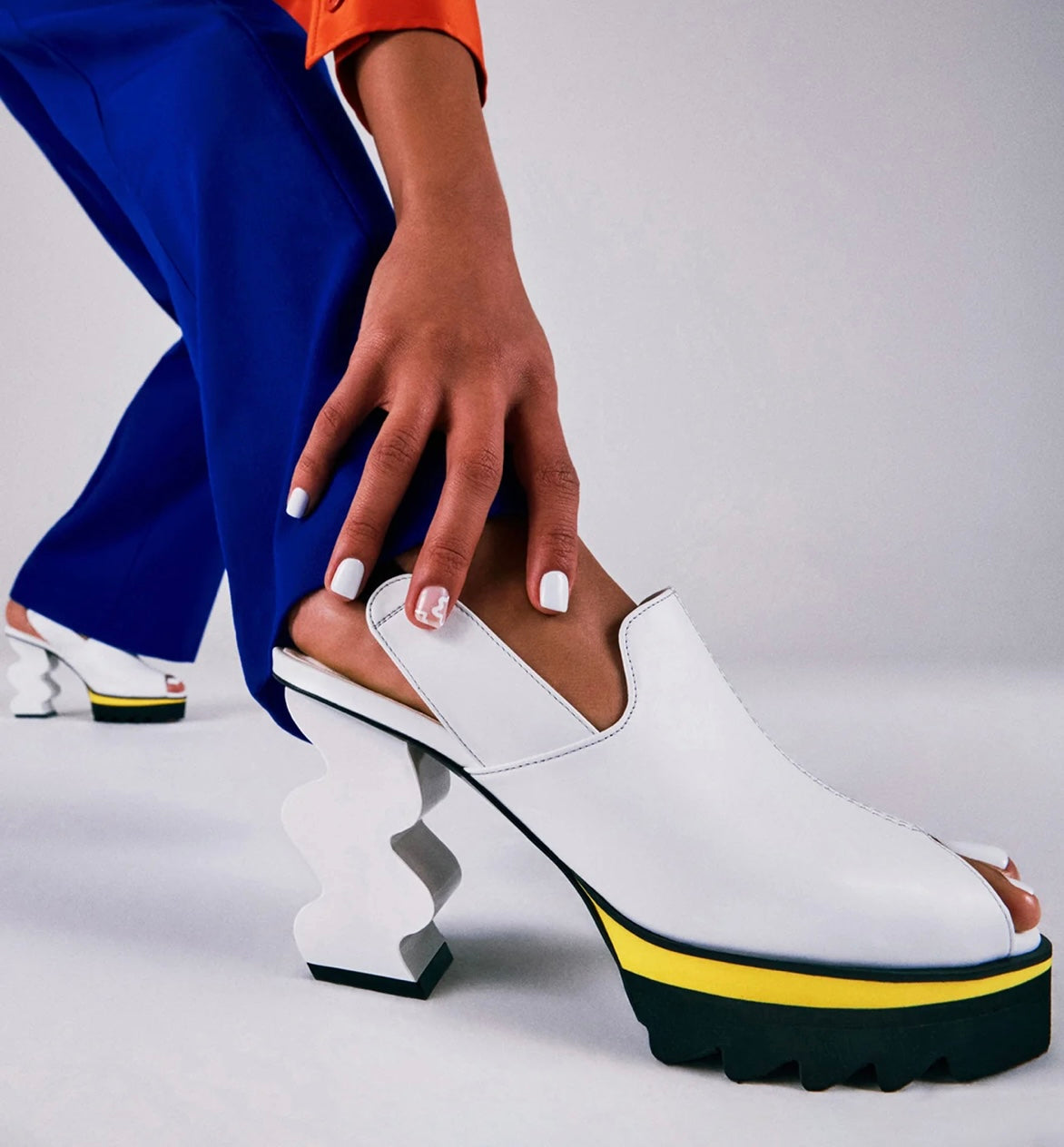 White heel with black & yellow sole model
