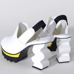 White heel with black & yellow sole heel view